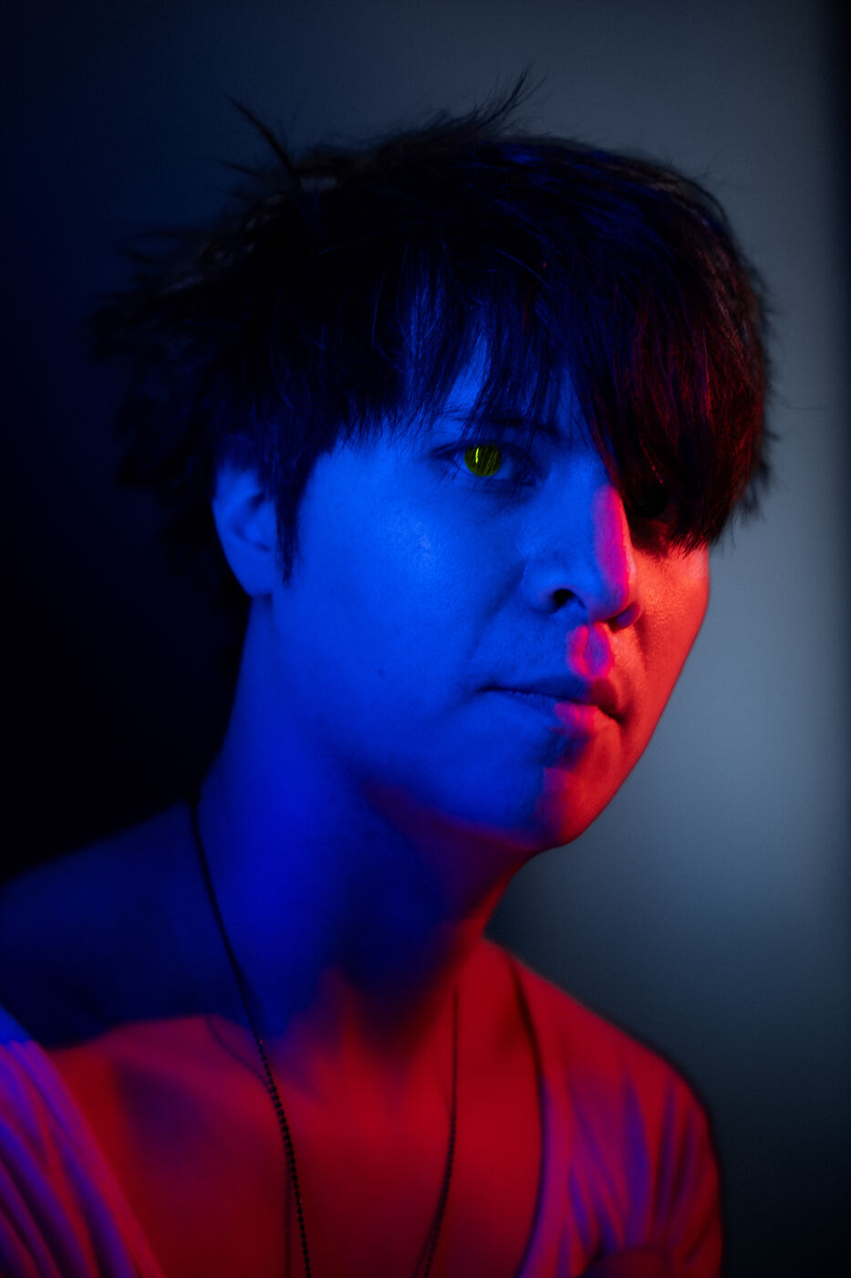 Split-tone neon studio portrait